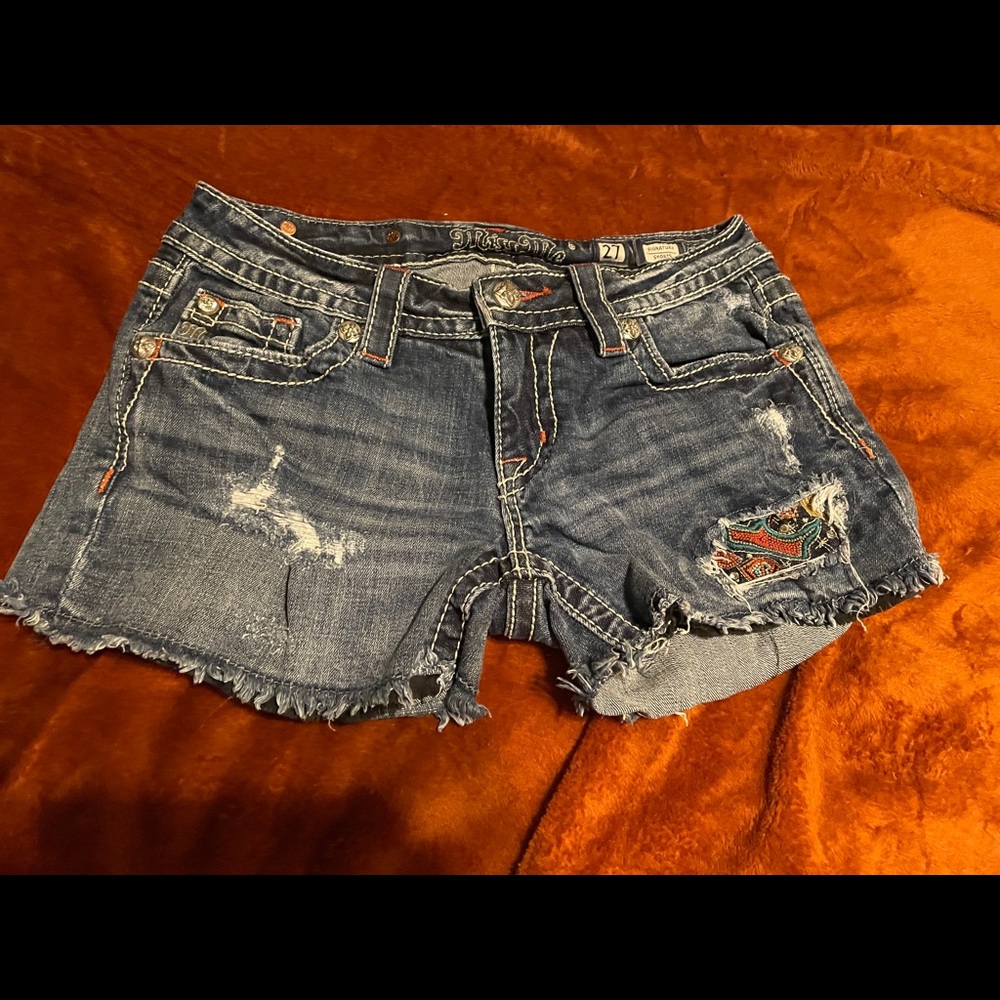 Miss Me jean shorts with
lots of detail in excellent condition.